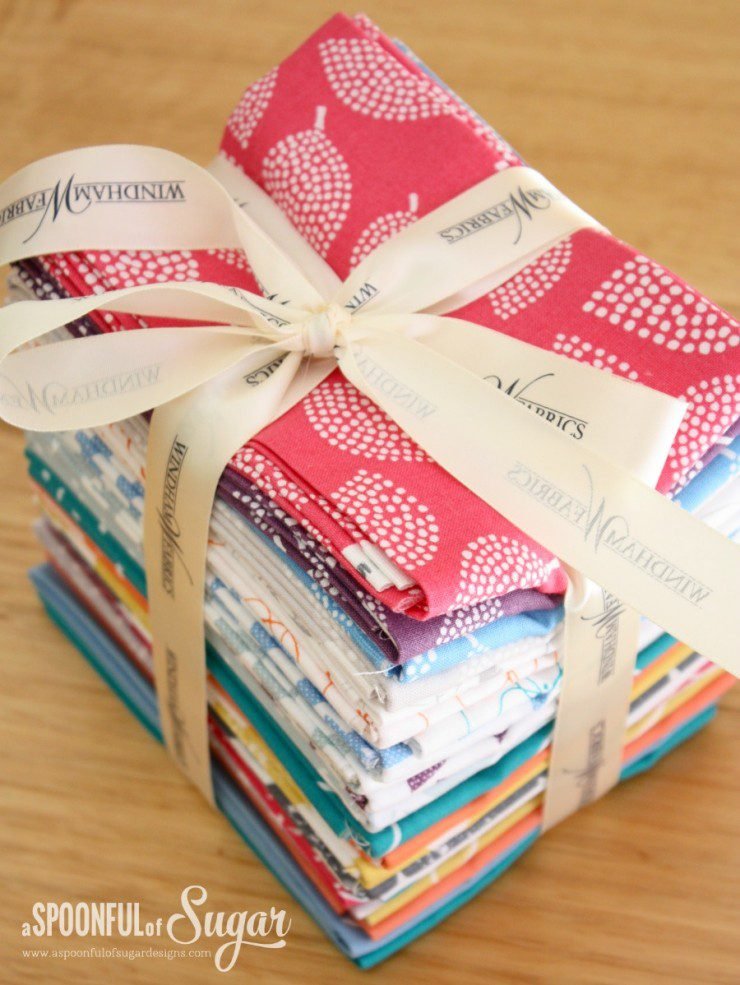 bundle of brightly coloured fabrics.