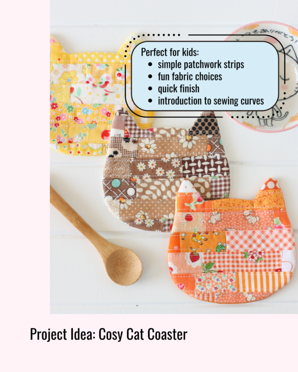 Three patchwork cat‑shaped coasters made from colourful fabric strips, arranged beside a spoon and dish. Beginner sewing project introducing simple patchwork and gentle curves.