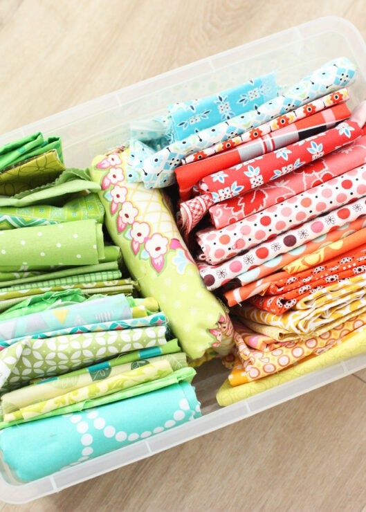 tub of folded brightly coloured fabrics