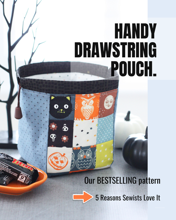 Halloween Handy Drawstring Pouch made with patchwork squares featuring fussy-cut cats, owls, pumpkins, and moon motifs in orange, blue-grey, cream, brown, and citron fabrics.