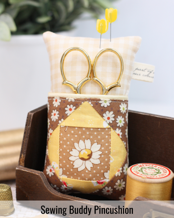 Handmade Sewing Buddy pincushion featuring patchwork fabric and practical storage for pins and hand-sewing tools.