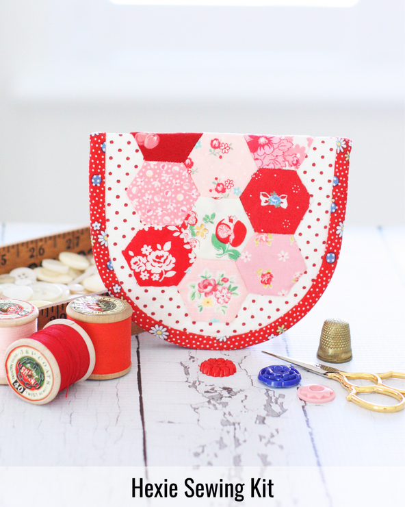 Hexagon-inspired sewing kit featuring storage for hand-sewing supplies, needles, thread, and English Paper Piecing tools.