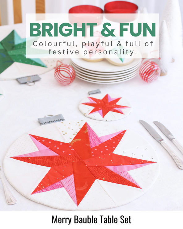 Colourful quilted Christmas table set featuring bright festive fabrics and cheerful bauble-inspired designs.