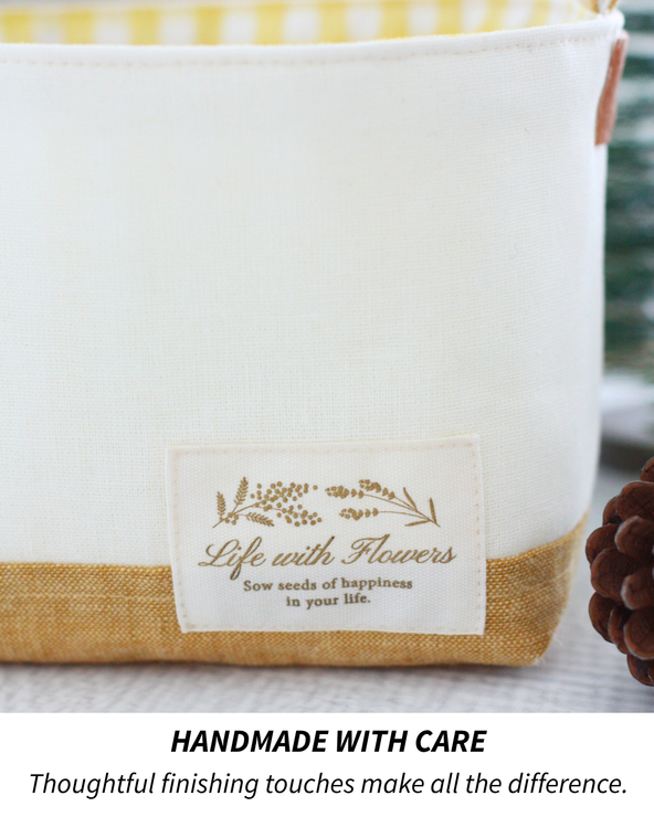 Close-up of decorative fabric label and finishing details on a handmade Luma Bucket storage basket.